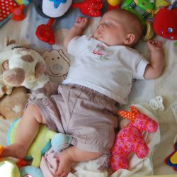 Canva - Child, Sleep, Toys, Baby, People best playmats for newborns