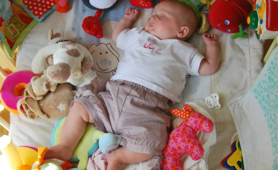 Canva - Child, Sleep, Toys, Baby, People best playmats for newborns