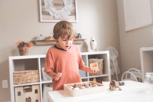 child playing in toddler bedroom