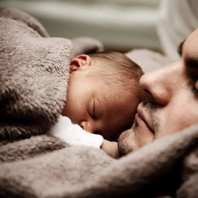 baby on belly with dad