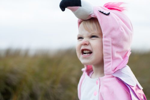 child in flamingo onesie