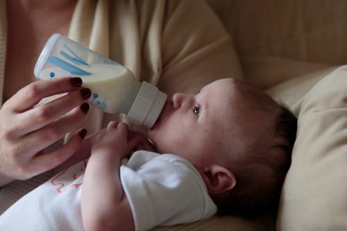 Baby feeding from a bottle