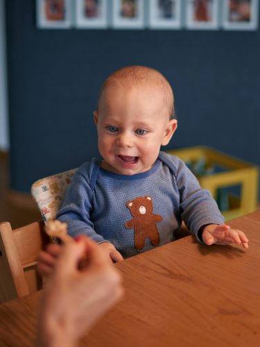 baby about to be fed baby food