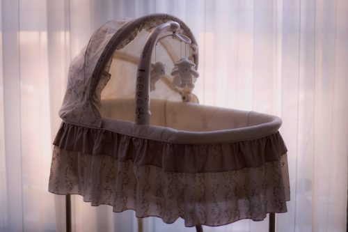 Basinet and teddy bear mobile