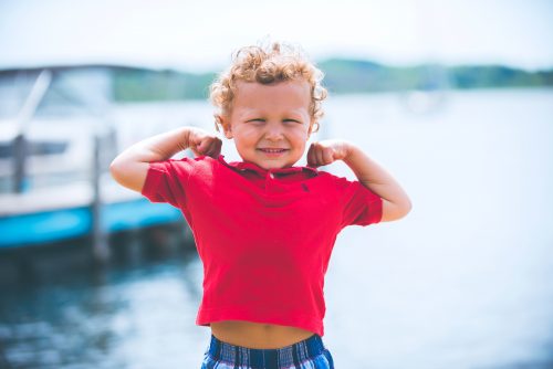 boy standing near dock