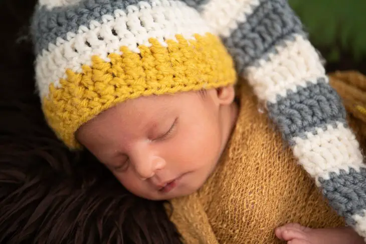 boy in yellow knit cap