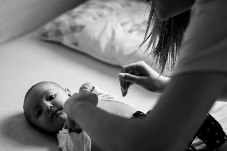 mom calming flailing baby