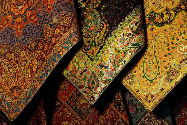 green blue and yellow paisley textile