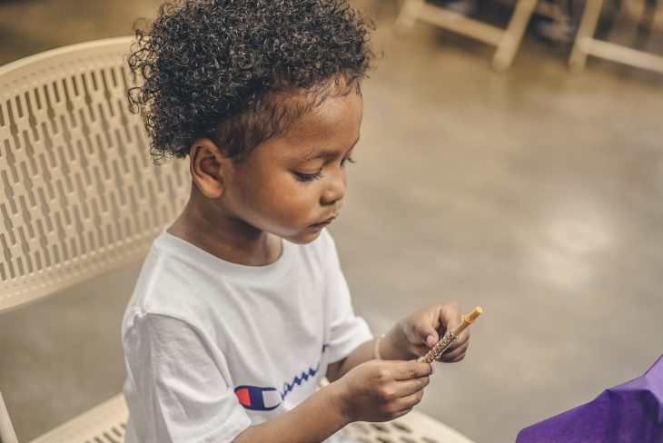 boy with very curly hair