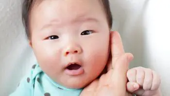 when do babies stop scratching their face